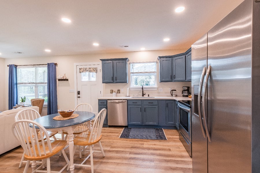 Kitchen has full-sized refrigerator with door accessible water and ice, oven, glass-top stove, dishwasher, toaster oven and Keurig coffee maker.