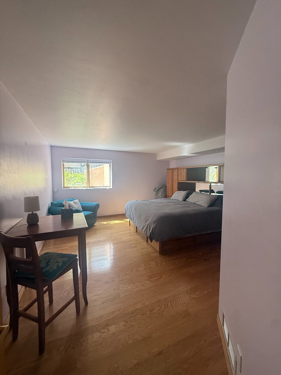 Private bedroom with desk and lounge chair