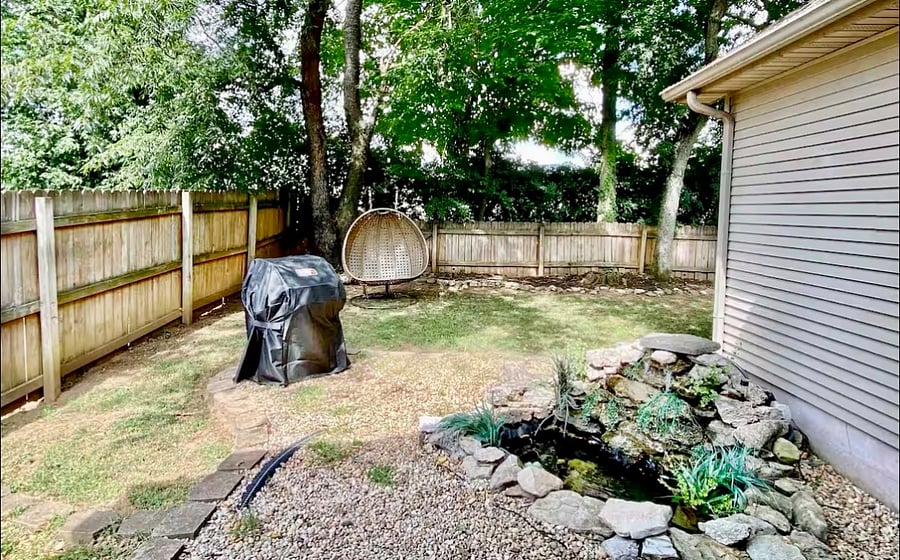 Weber gas BBQ grill, waterfall with babbling brook sounds.