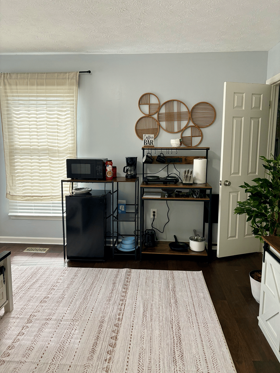 microweave, mini fridge, electric portable two burner stove, small kitchenette with basic supplies, including cutting board, cooking ultensils, toaster, pot and pan.