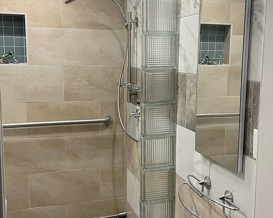 Tiled walk-in shower.