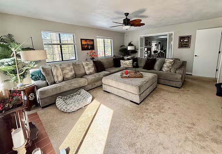 family room with 75" flat screen