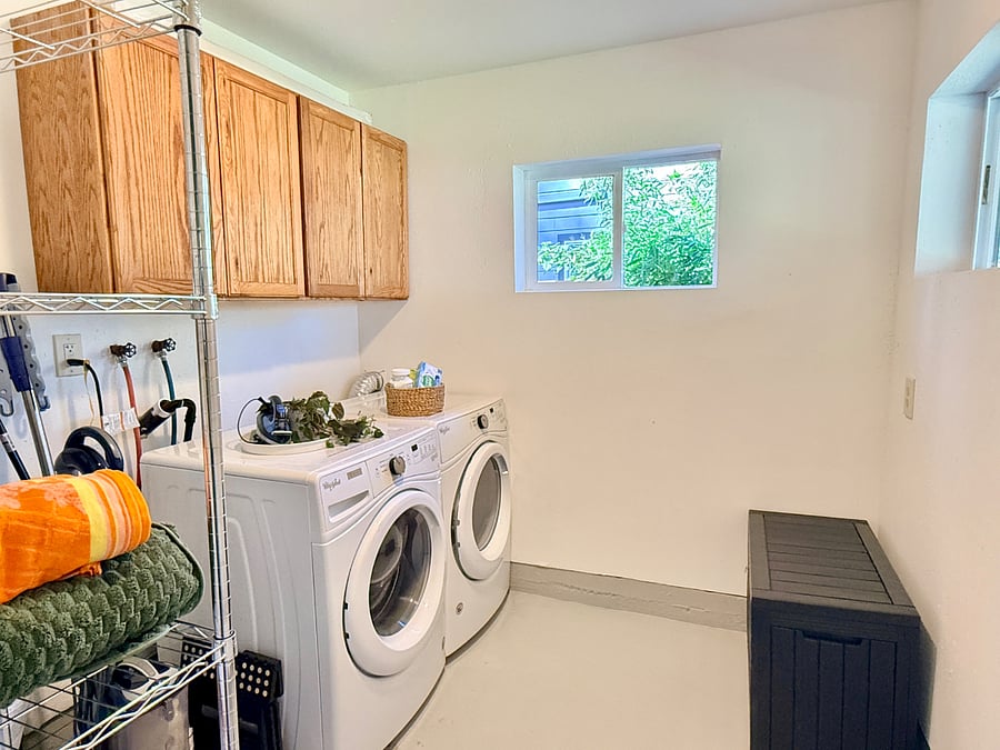 Laundry/utility room with ironing board and drying rack