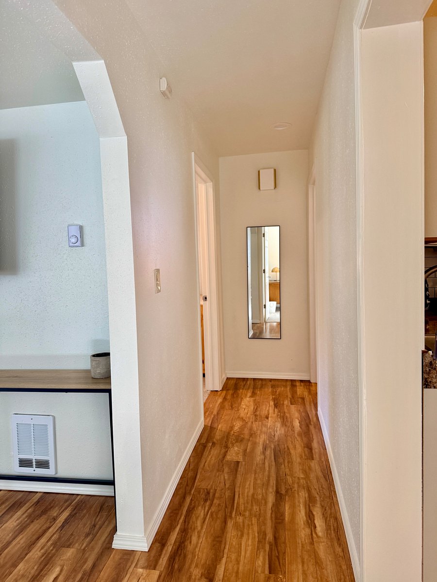 Hall way to 2nd queen bedroom and large bathroom