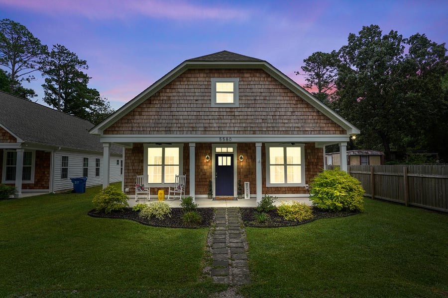 Exterior front view at night.