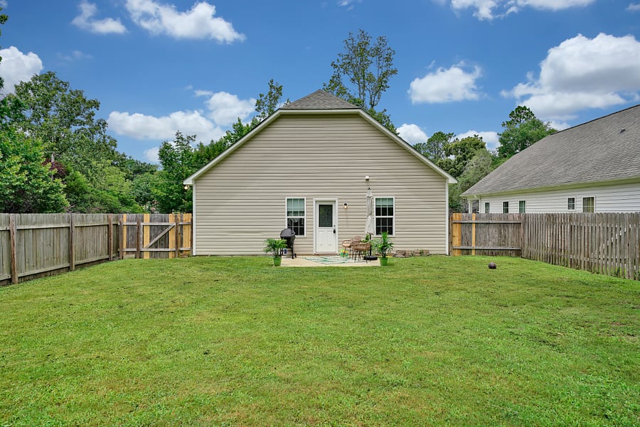 Fenced in yard view back to house