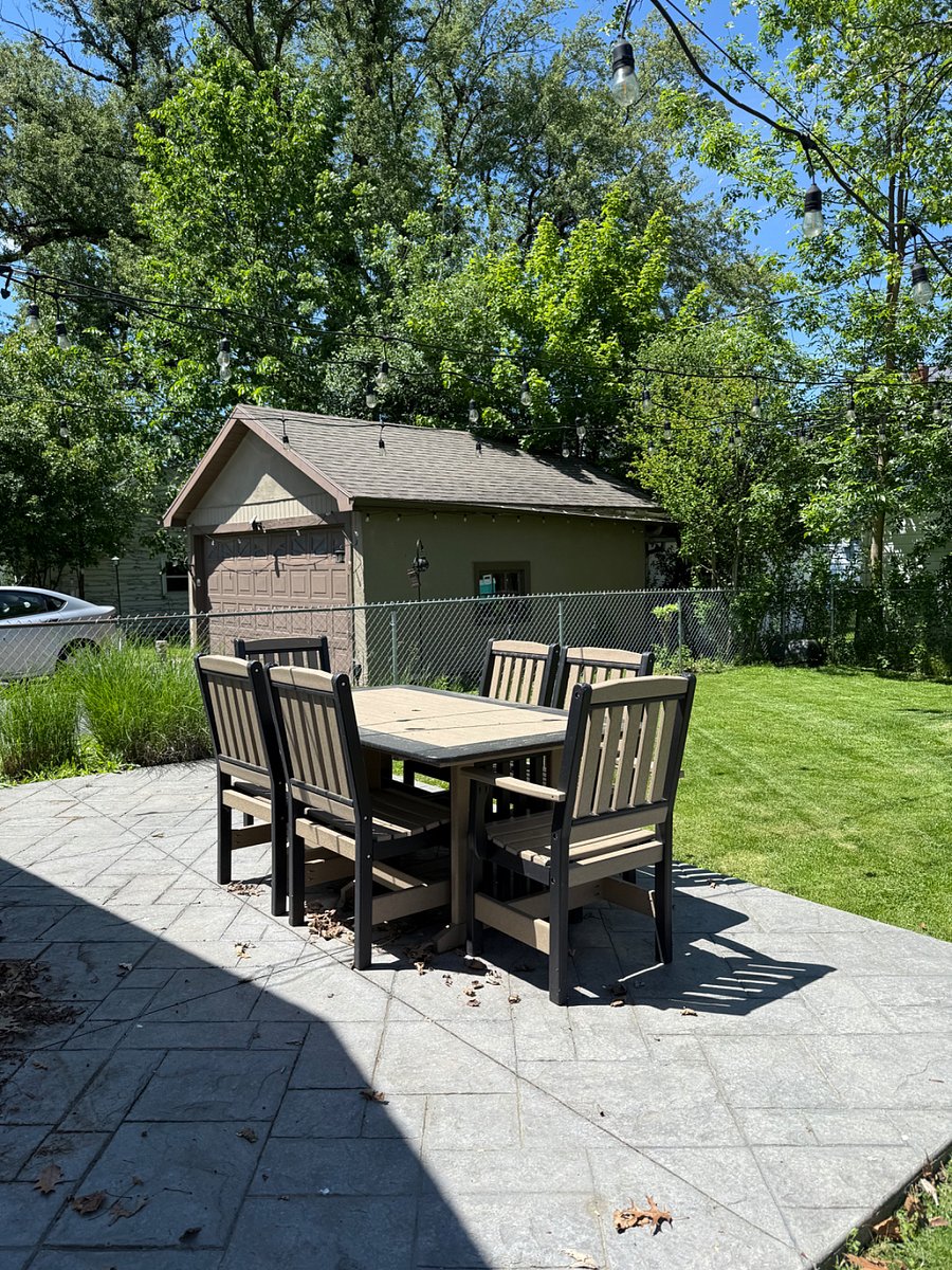 After a busy day at Strong Memorial Hospital or the University of Rochester, unwind in the fully fenced backyard. The stamped concrete patio, outdoor dining area, and ambient string lights create the perfect setting for relaxing, enjoying a meal outdoors, or spending time with family and friends.