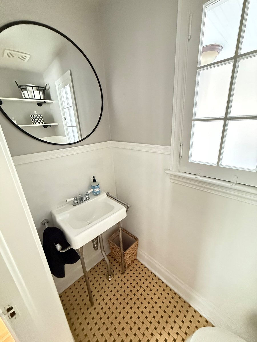 A convenient half bath on the main floor adds extra flexibility and privacy during your stay. Situated adjacent to the dedicated office, its ideal for remote workers and guests who appreciate having an additional bathroom available.