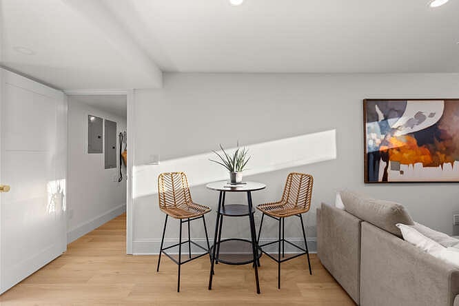 Entry door to apartment and bistro dining table