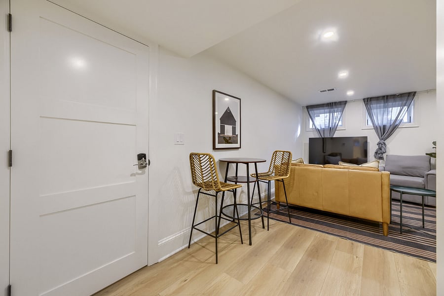 Entry door to apartment and bistro dining table