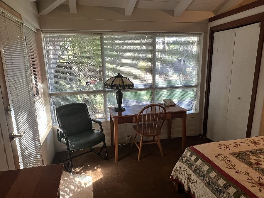 Main house second bedroom with view of the front yard.