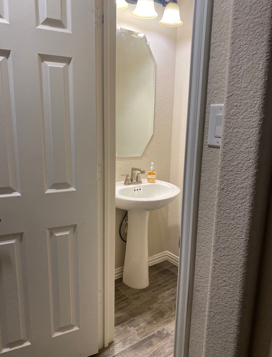 Additional half bathroom available downstairs . 