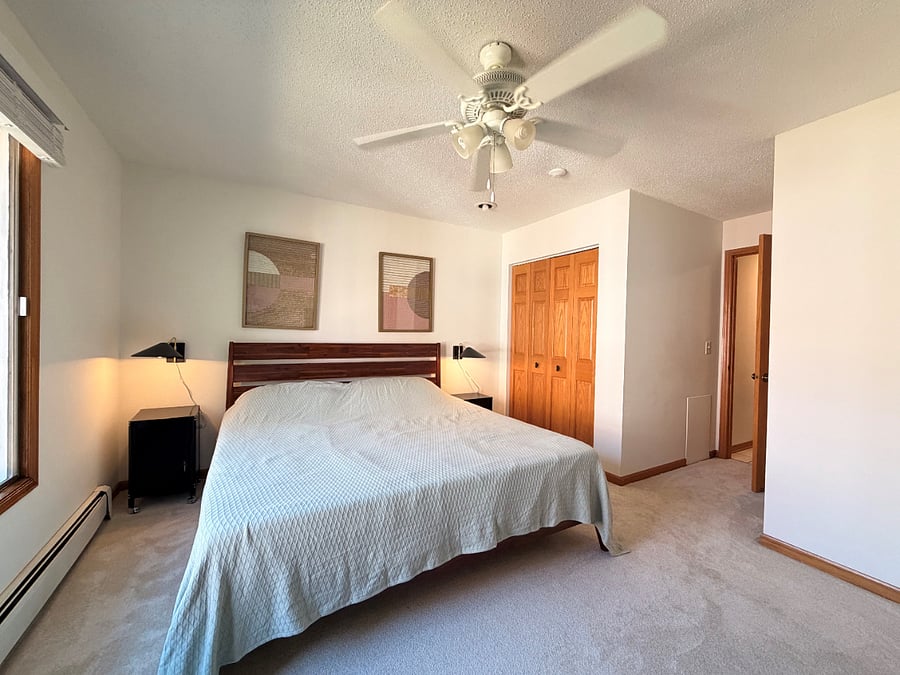 Bedroom with king bed. Winter comforter in closet.