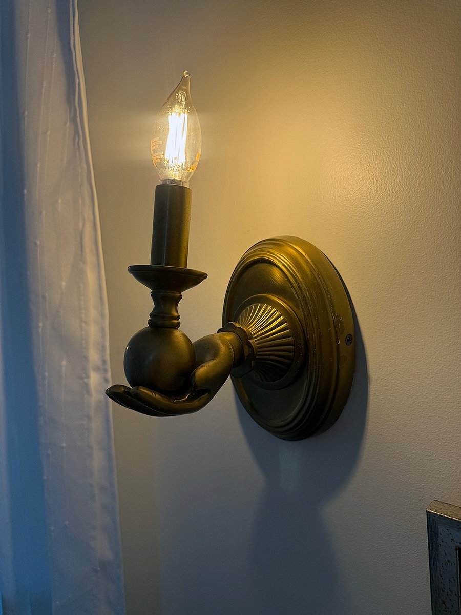 One of the two boutique sconces in the bedroom