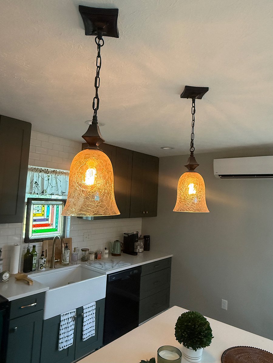 Pendant lights above the kitchen counter space