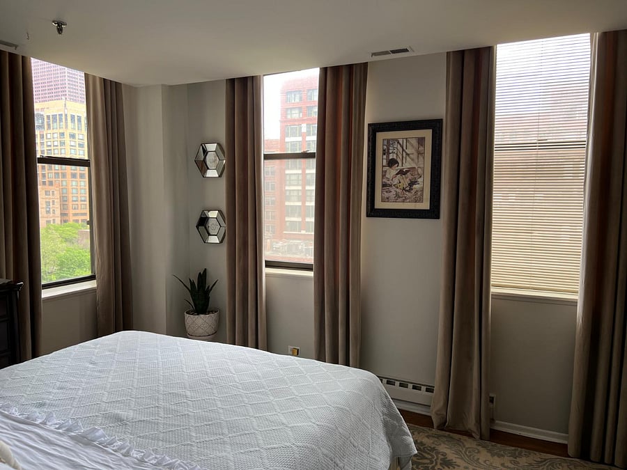 Primary bedroom corner-unit view.