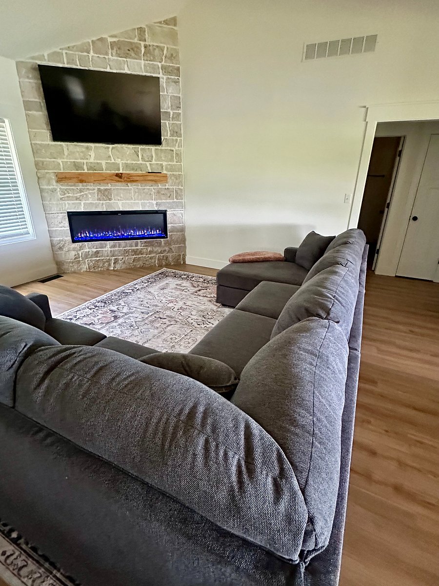 Living Room w/ fireplace and large screen smart TV