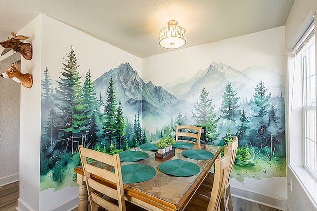 Forest-themed dining area seats 6
