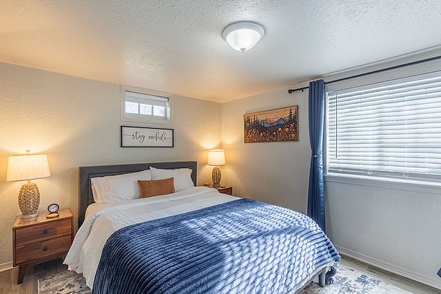Bedroom 3 (downstairs): Relax in the queen memory foam bed in this cozy, mountain-themed room. Enjoy a 28" smart TV with Blu-ray, a built-in vanity area (or workspace), small walk-in closet, white noise machine, and a clock for your convenience.