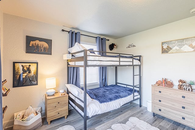 Welcome to the Bear Cave! This fun and cozy room features new (2026) gel memory foam twin bunk beds, each supporting up to 400 lbs, making them suitable for both kids and adults. The room includes bear-themed decor, toys, and books, along with a bright backyard-facing window, closet, full-length mirror, and white noise machine for a comfortable nights sleep. It works well for children or adult guests!