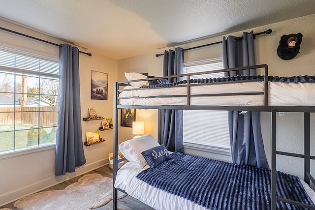Welcome to the Bear Cave! This fun and cozy room features new (2026) gel memory foam twin bunk beds, each supporting up to 400 lbs, making them suitable for both kids and adults. The room includes bear-themed decor, toys, and books, along with a bright backyard-facing window, closet, full-length mirror, and white noise machine for a comfortable nights sleep. It works well for children or adult guests!