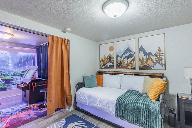 Bedroom 4 (downstairs): This room sleeps 2. Memory foam twin bed with trundle bed, 55" smart TV with Blu-ray, and fun tree stump pillows. Separated from the game room by a curtain for privacy, with a comfy bean bag for relaxing or movie nights.