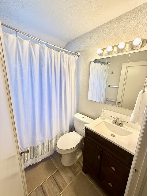 Upstairs bathroom includes a full bath/shower, plus starter shampoo, conditioner, and body wash. Also has a hair dryer.