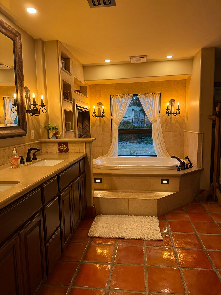 Master Bath Tub with privacy drapes and tinted glass