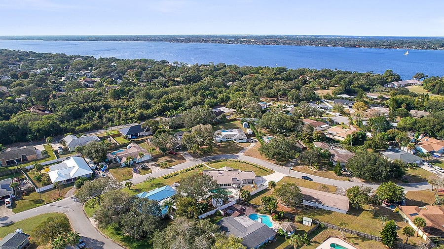 Aerial facing east to Banana River and the ocean