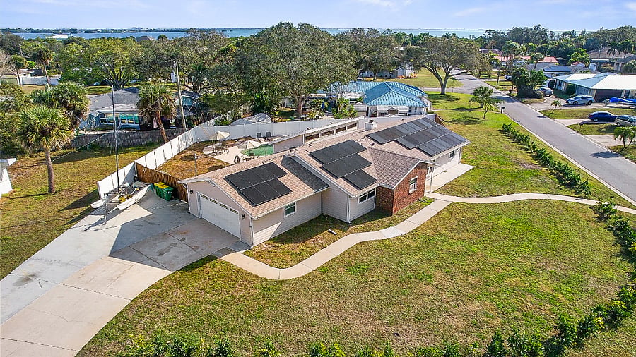 Side of home with large driveway