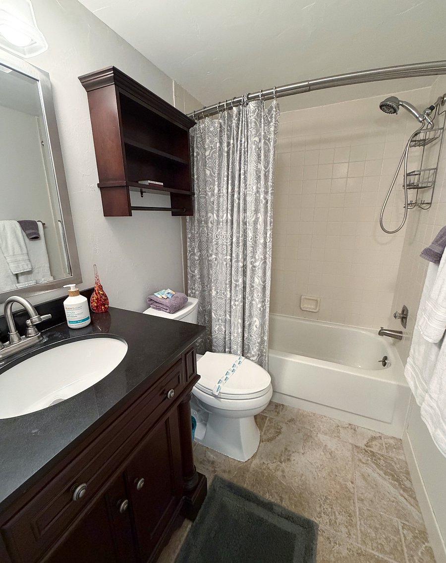 Guest bath with a tub/shower combo.