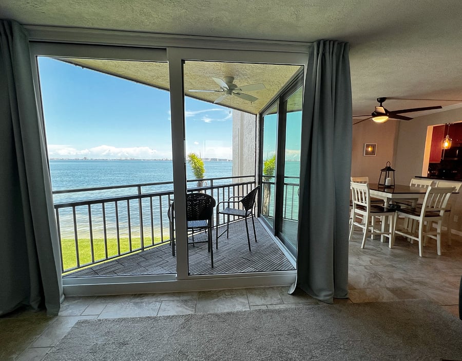 Enjoy a view of the water from the front door, living room, dining room, and master bedroom.