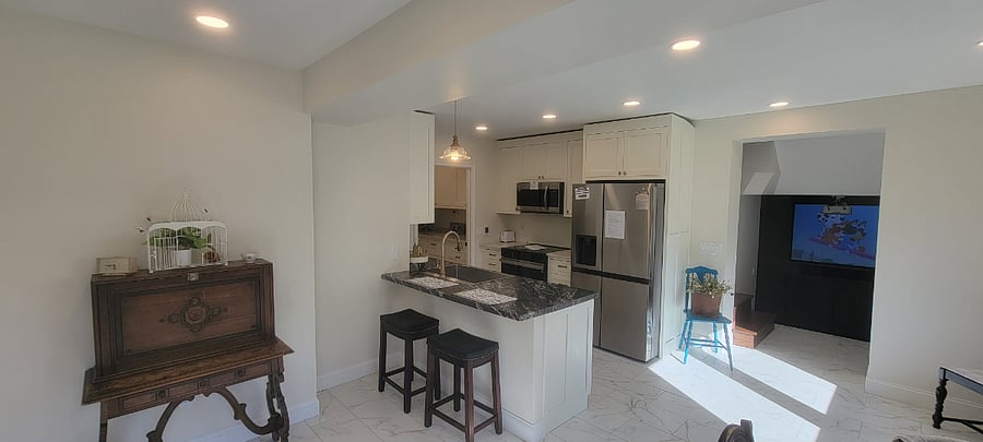 Kitchen with full size fridge, microwave, dishwasher and hot drink center