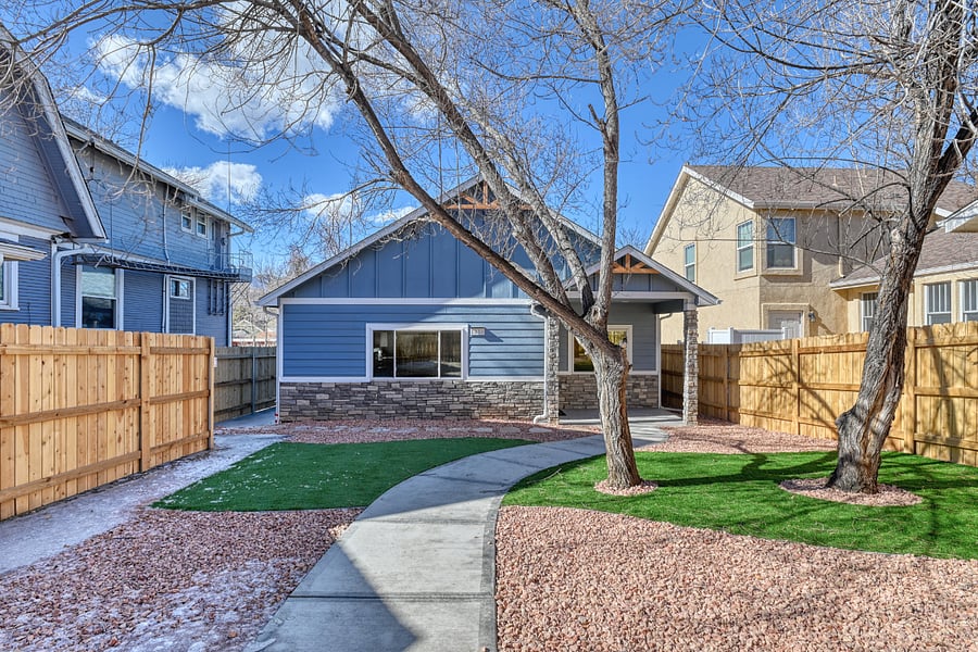 Front of the house inside the fenced in yard