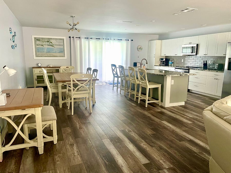 Open concept kitchen, dining and living room. 