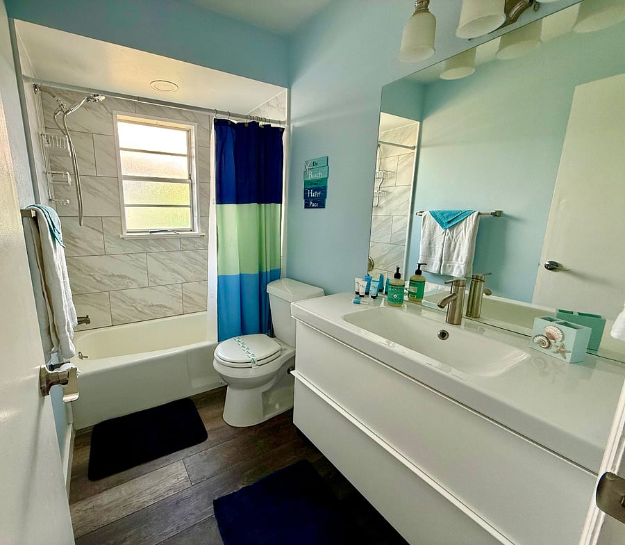 2nd bathroom with tub and shower combo.