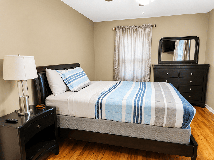 2nd Bright and inviting bedroom with large dresser and natural light