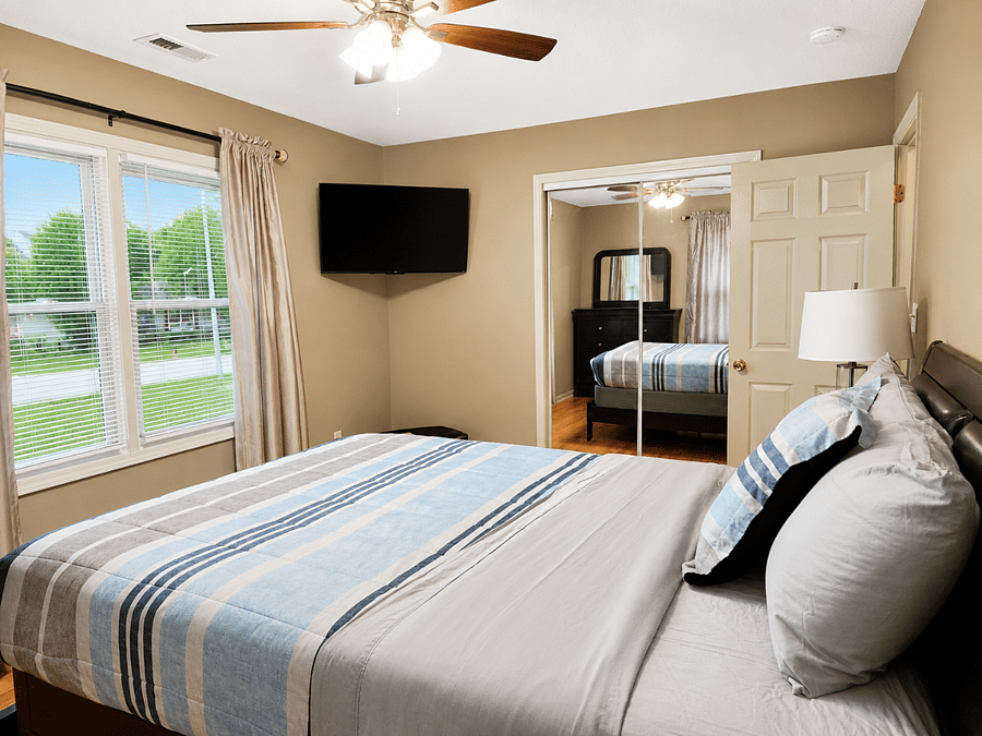 Relax in 2nd bedroom comfort with in-room TV entertainment and hardwood floors