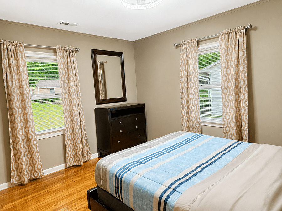 Comfortable bedroom featuring a dresser for extra storage