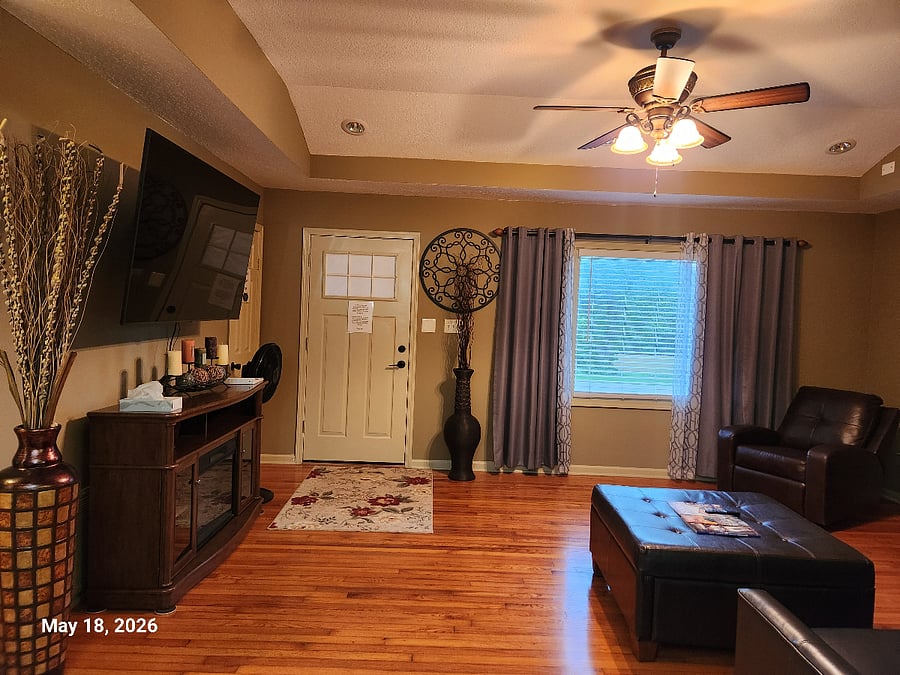 Relax in the spacious living room with large smart TV and vaulted ceilings