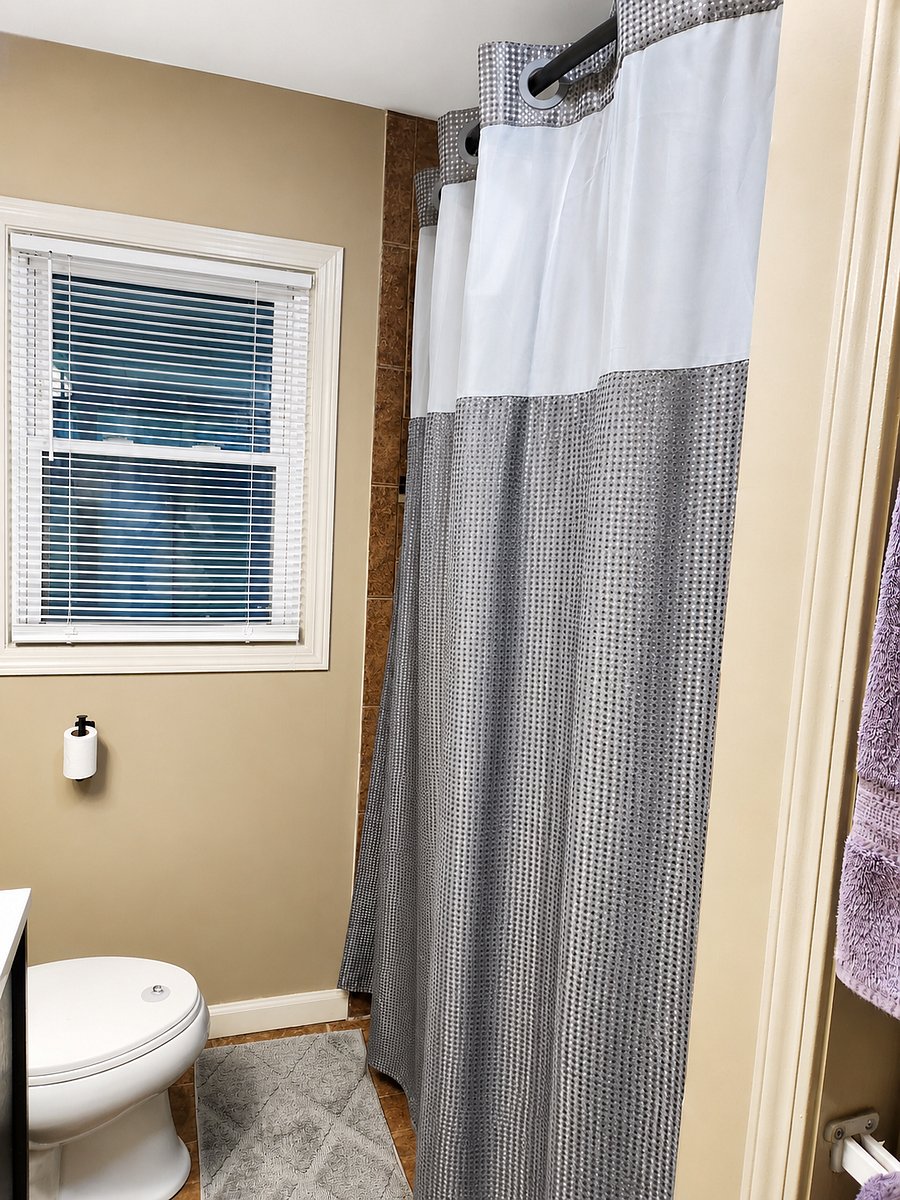 Bright bathroom with full shower and tub combination