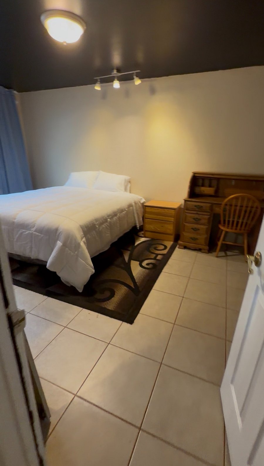 Bedroom includes:
King size bed
Large TV
Large wall window for natural lighting
Black out curtains
Lots of closet/storage space