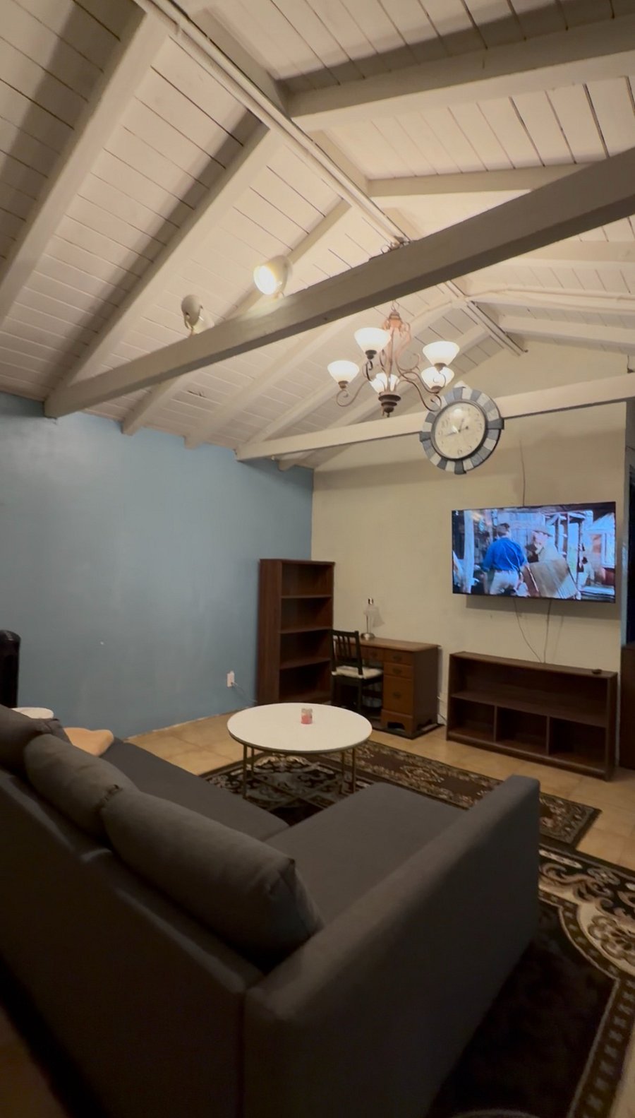 Large living room with:
Large TV
vaulted ceiling
pull out couch
desk