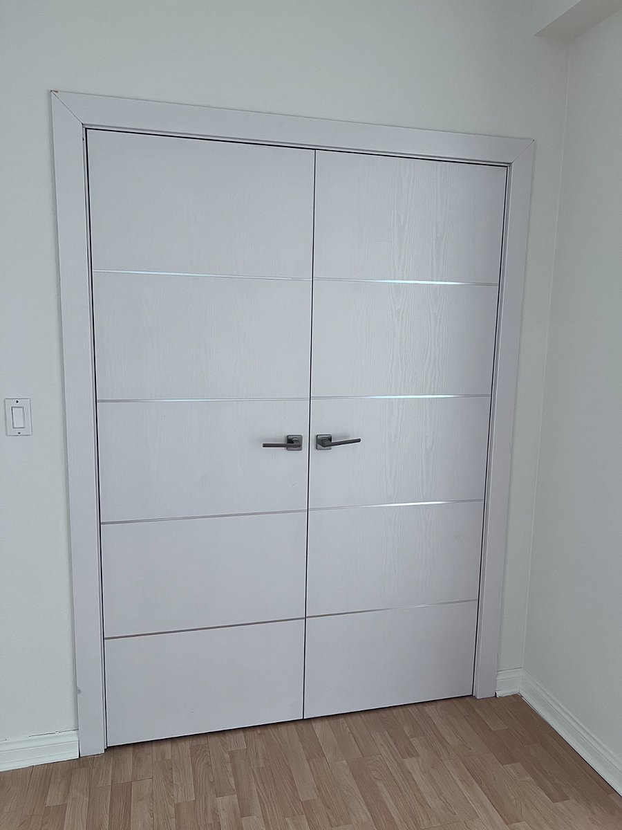 Door to stackable washer and dryer.