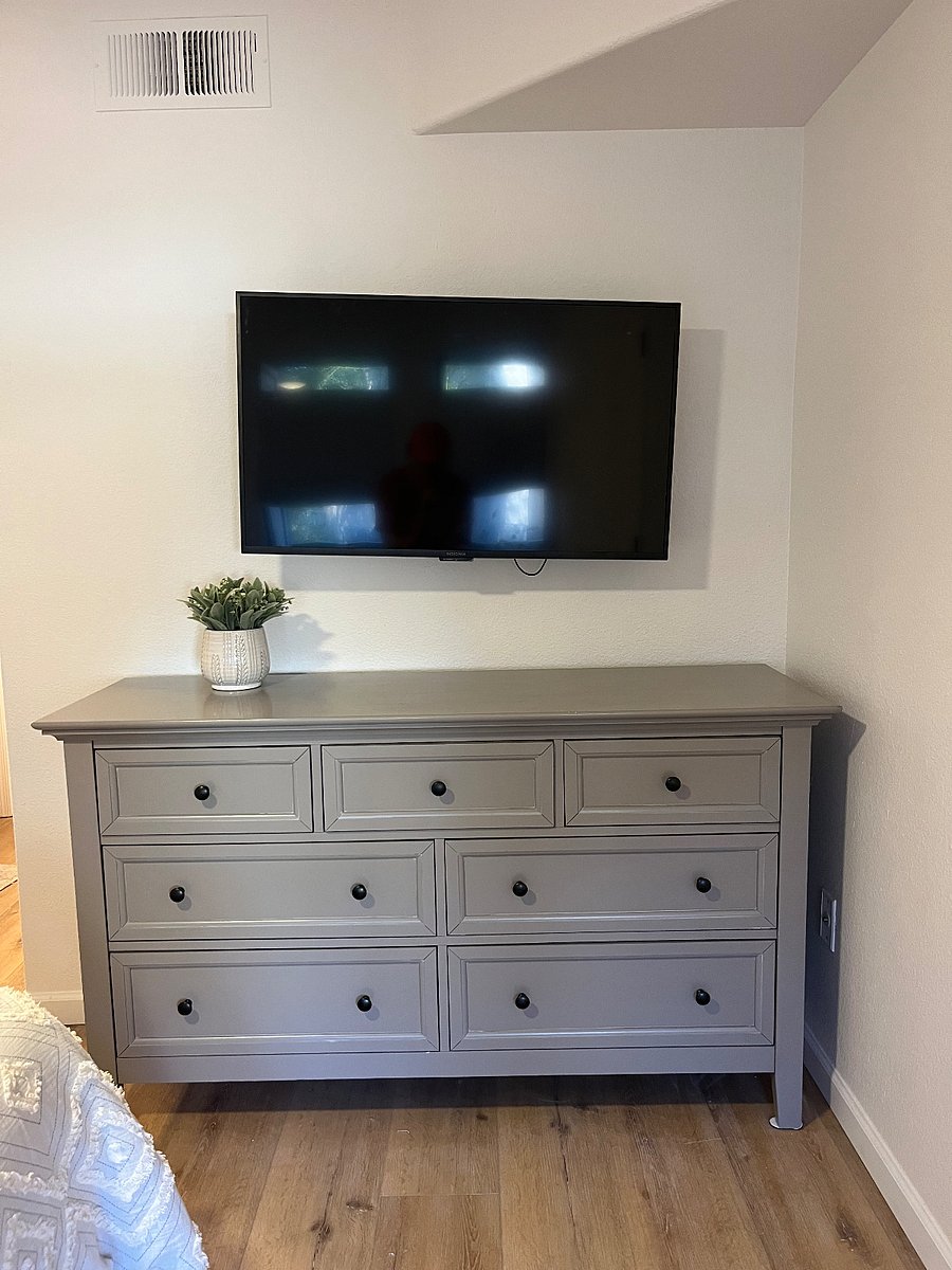Master bedroom full dresser, smart tv
