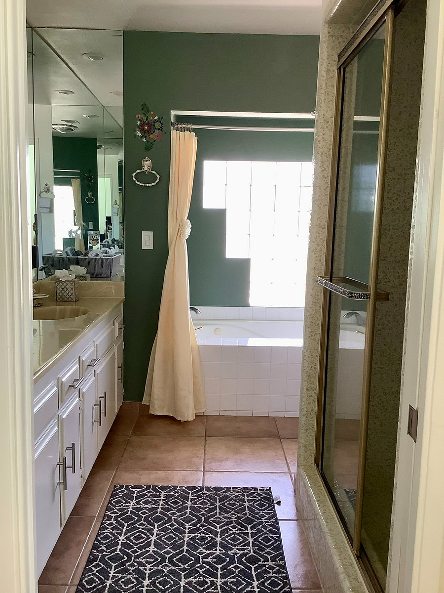 Primary Bathroom with two sinks, tub and shower