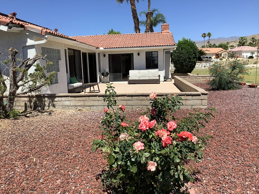 Patio with golf course views rose garden and fruit trees