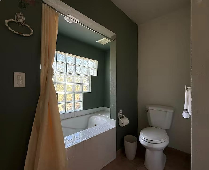 Primary Bathroom with two sinks, tub and shower