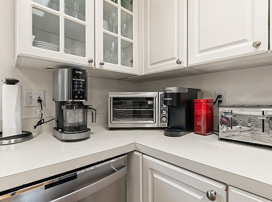 Premium kitchen appliances including Ninja coffee system, Keurig, and toaster oven.