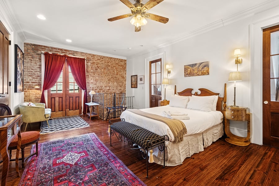 Upstairs queen bedroom with ensure bathroom and private balcony